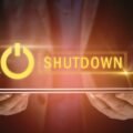 A graphical image of a man holding a tab with shutdown floating on the top, depicting US Healthcare AI program shutdown