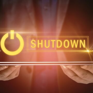 A graphical image of a man holding a tab with shutdown floating on the top, depicting US Healthcare AI program shutdown